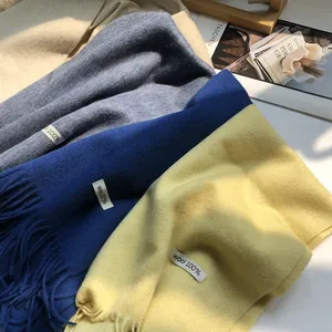 Close-up of 100% Australian wool scarves with fine tassels and soft texture