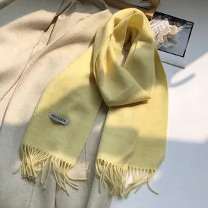 Detail of soft 100% Australian wool scarf with long tassels and premium texture