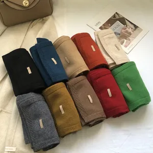 Premium 100% Australian wool scarves in multiple colors with elegant knitted texture