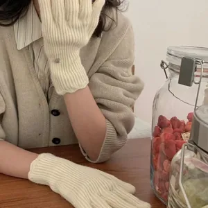 Thick cream knitted winter gloves with touch screen design and elegant wavy cuffs