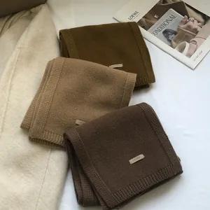 Premium 100% Australian wool scarves in earth tones of dark brown, caramel and green