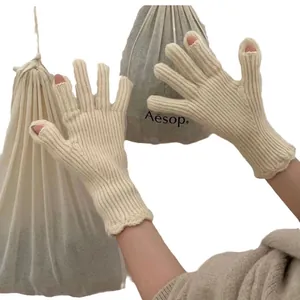 Winter thermal knit gloves in beige featuring touchscreen-friendly finger openings