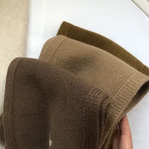 Close-up of soft Australian wool scarves in earth tones with refined ribbed knit texture