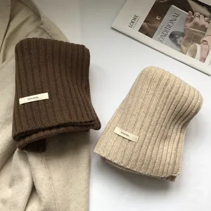 Thick 100% wool scarves in dark brown and beige with ribbed texture and minimalist style