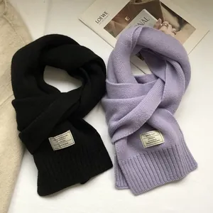 Classic 100% Australian wool scarves in black and lilac featuring a soft ribbed knit texture