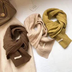 Knitted 100% Australian wool scarves in brown, beige, and yellow with cable knit pattern