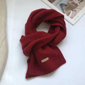 Detail showing 100% pure Australian wool texture and rib edge of this dark red scarf