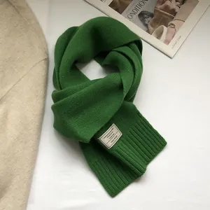 Macro view of grass green 100% Australian wool scarf with chunky knit texture