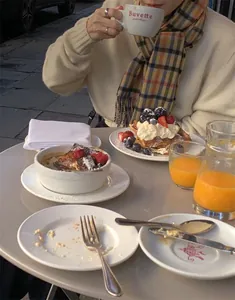 Detail of colorful plaid wool scarf in an outdoor cafe scene with elegant British style