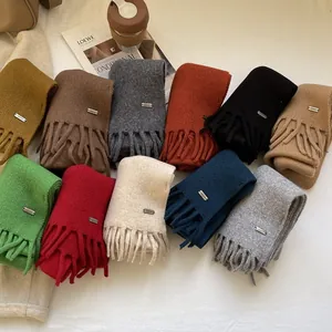 Premium 100% wool knit scarf collection with elegant fringes in versatile earth tones