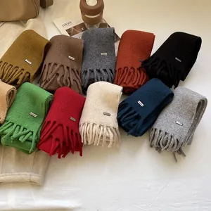 Classic 100% wool knit scarves with fringe details in diverse earthy tone colors