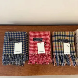 Three premium checkered wool scarves with tassels in blue, yellow, and red colors