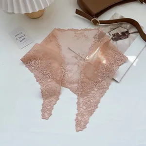 Detail of pink floral lace triangular scarf with rose embroidery and mesh texture
