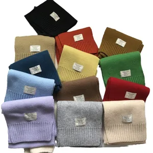 Stack of multi-colored 100% Australian wool scarves in various vibrant color options