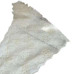 Elegant cream lace headscarf with floral embroidery and delicate scalloped edges