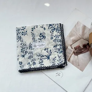 Floral print cotton square scarf with navy lace trim on white background