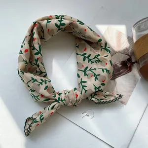 Close-up of floral cotton linen neckerchief with green crochet lace trim details