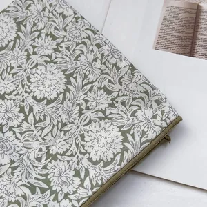 Elegant floral canvas laptop sleeve with vintage green botanical print and zipper