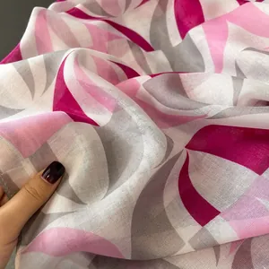 Close-up of semi-transparent printed scarf fabric with abstract geometric patterns