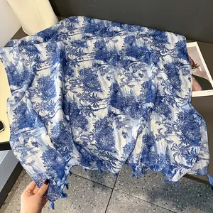 Blue Toile de Jouy print scarf with elegant tassels and lightweight fabric texture