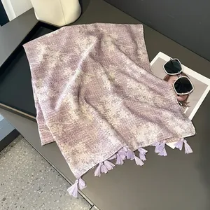 Elegant lavender purple scarf with delicate floral patterns and long fringe tassels
