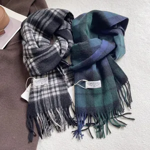 Classic checkered wool scarves with tassels in blue and black plaid patterns
