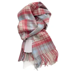 Pink and blue plaid wool scarf with long tassels and 100% wool label on white background