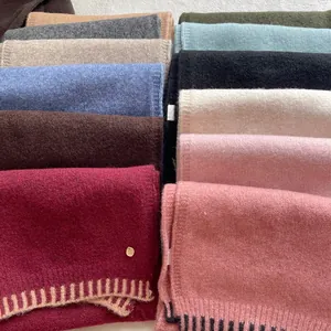 Cozy wool blend knit scarf for women with contrast stitched edges in multiple colors