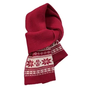 Classic red Fair Isle knitted wool scarf featuring large white snowflake patterns