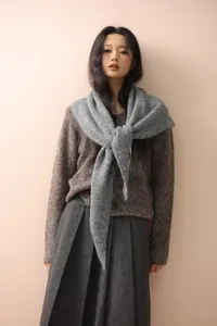 Detail shot of the grey knit texture on this warm winter shawl for women