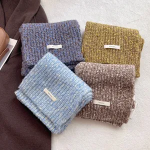 Mixed color wool knit scarves for winter in navy, yellow, blue, and brown shades