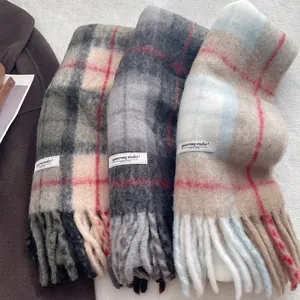 Plaid wool blend tassel scarf in grey, blue and beige tones with stitched label