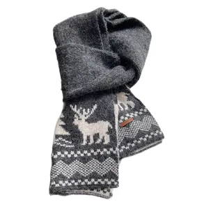 Winter knitted wool scarf with festive white reindeer patterns and soft plush texture