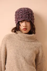 Detail of multi-color wool knit fisherman hat with vintage textured crochet pattern
