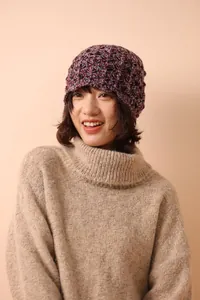 Detail of multi-color wool knit beanie with textured honeycomb pattern and warm design