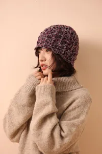 Detail of vintage wool crochet bucket hat with textured knit pattern and short brim