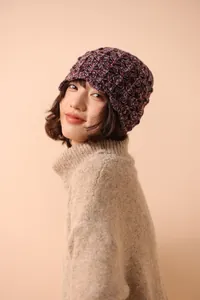 Detail of multi-color thick knit wool fisherman hat featuring a chunky textured pattern