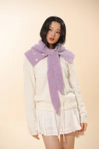 Detail of purple knitted balaclava neck warmer featuring white buttons and fuzzy texture
