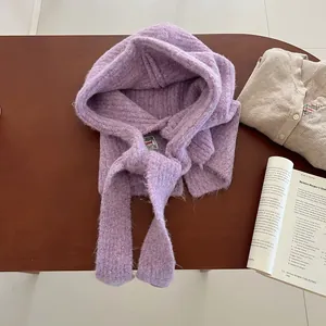 Detailed texture of purple knitted balaclava with long fluffy fibers and ribbed edges