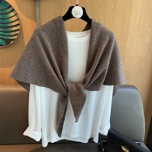 Detailed close-up of premium 100% wool triangular scarf styled over a white shirt