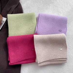Glacier blue 100% wool knitted scarf for women in four solid colors with metal labels
