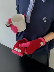 Detailed knit texture of warm winter touchscreen gloves in red and purple colors