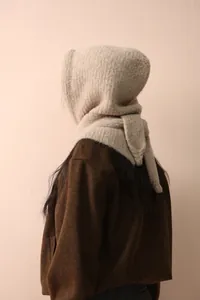 Detailed close-up of oatmeal knit Balaclava hood scarf with soft plush texture