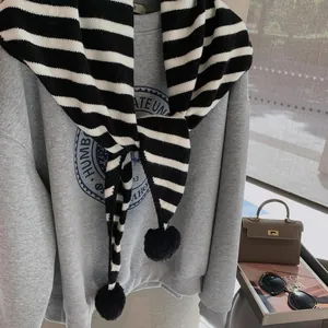 Cute black and white striped knitted scarf with pom poms for women casual autumn style