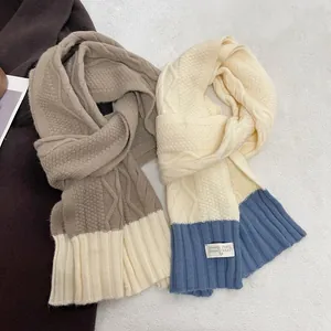 Pink and blue chunky knit scarf with stylish patchwork and warm cable weave pattern