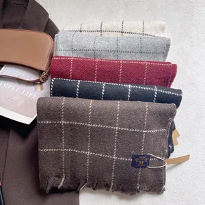 Classic plaid tassel scarf set in warm autumn colors like beige, grey, and burgundy