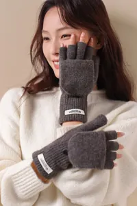 Detailed knit texture of 100% wool flip top mittens with colorful speckled yarn and tag