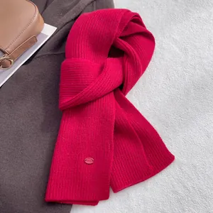 Macro shot of red rib-knit wool scarf texture with elegant lifestyle accessories