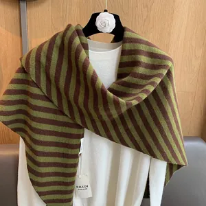 Detail of 100% wool striped shawl with green and brown stripes and handmade label