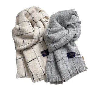 Cozy plaid checkered scarf with tassels for winter fashion in cream and light grey tones